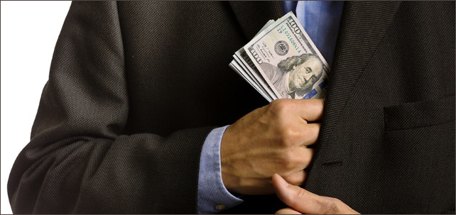 Corporate Businessman Slipping US dollars Money into Suit Pocket