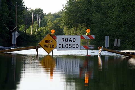 Road Closure Signage As Water Covers The Road